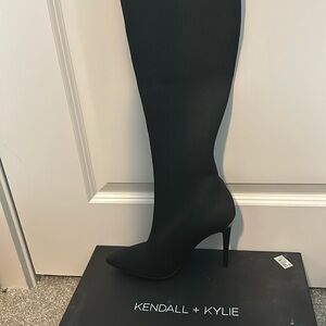 Brand new, black, thigh-high heeled boots